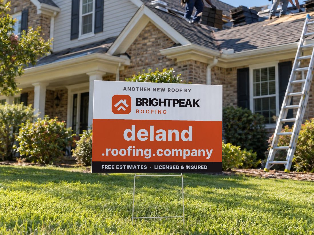 deland.roofing.company on a yard sign in front of a house getting a new roof